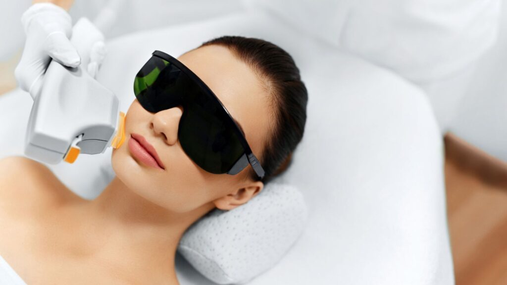 woman getting laser facial treatment